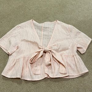 Light pink crop top that ties in front